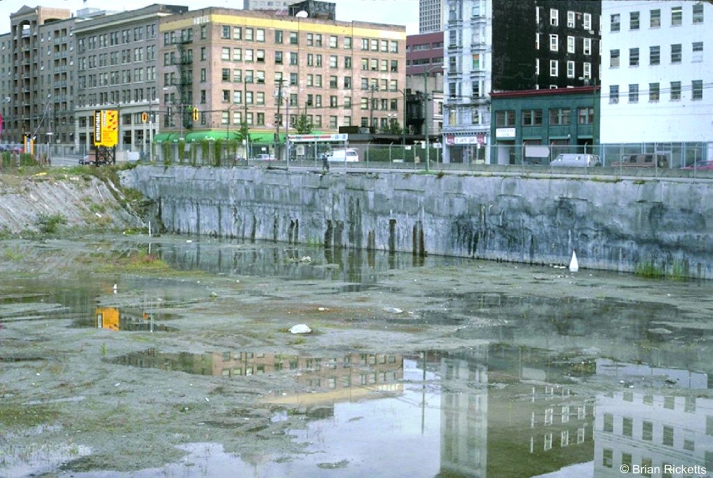 Concrete on the wall of this downtown Vancouver construction site prevents seepage of creosote (from old milling operations)