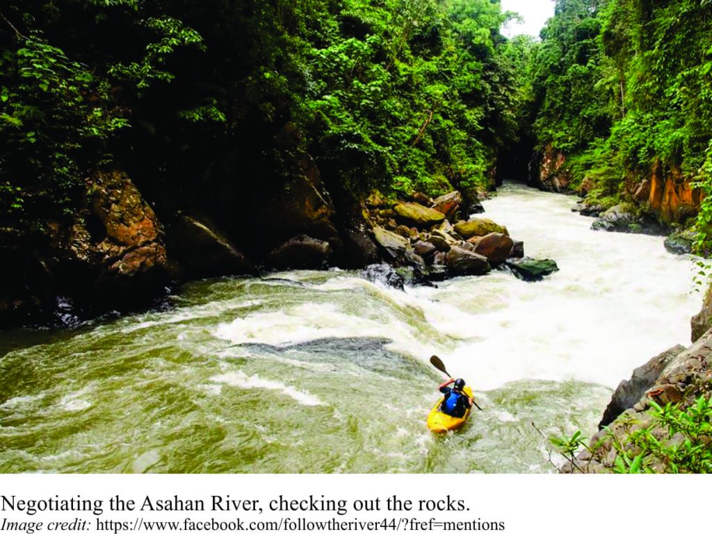 Kayaking down Asahan River, north Sumatra. This river has all but been destroyed by a dam project