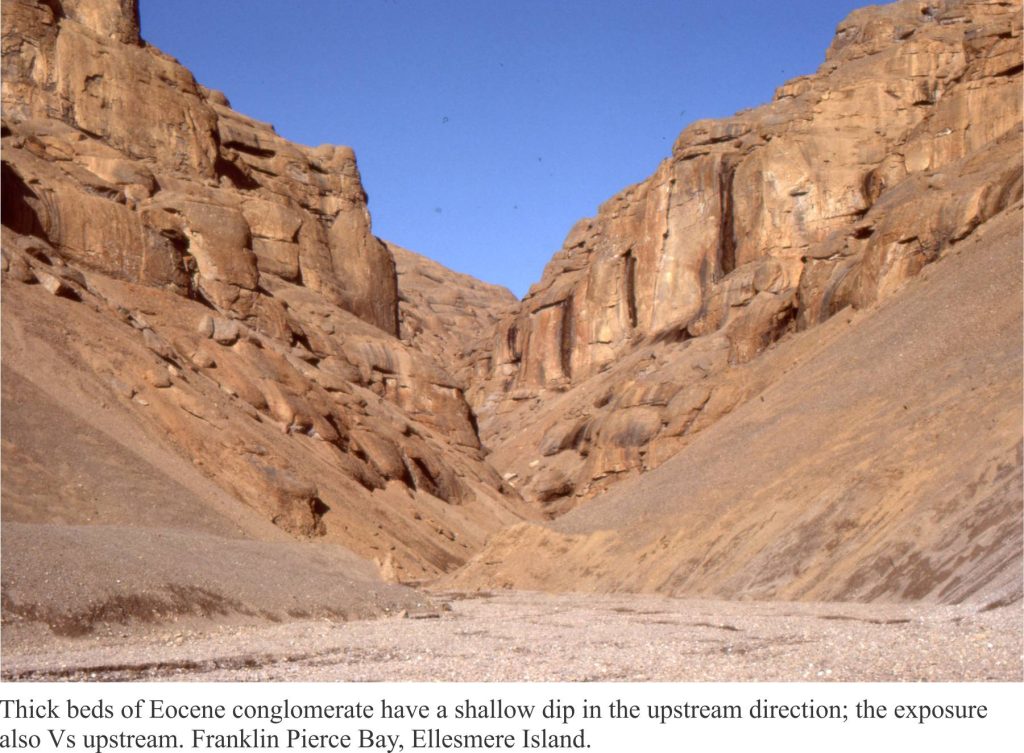 Conglomerate beds v-ing and dipping towards the upper valley