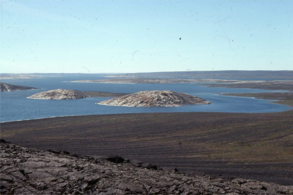 The staircase of raised beach ridges, over an altitude gain of about 100 m from present sea level, has formed in response to lithospheric rebound following melting of the Laurentide Icesheet. The present rate of uplift is about 1 m/100 years. Tukarak Island, Hudson Bay. 