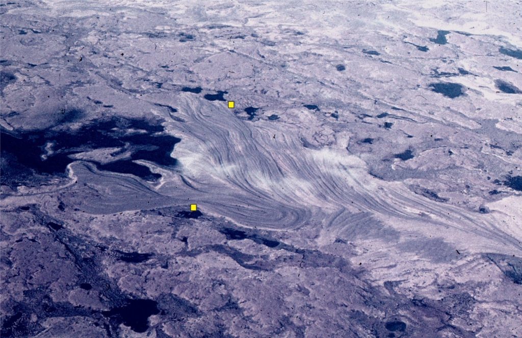 Raised gravel beach ridges resulting from glacio-isostatic rebound following melting of the Laurentide Icesheet. Belcher Islands. The distance between the yellow dots is 500 m. Modern beach is on the left.