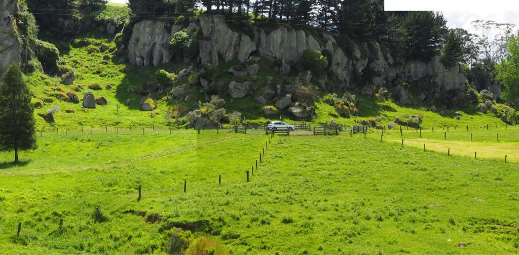 A panorama of the 1.21 Ma Ongatiti rhyolite-rhyodacite ignimbrite (Waikato, New Zealand), at least 11 m thick (base not exposed). At this locality (Castle Rock) there is no indication of extensive welding. At other localities, this ignimbrite is welded and contains several flow units ( Briggs et al., 1993) – see the thin section examples of welding in this ignimbrite. Elsewhere the ignimbrite thickens to 35 m and more. The eruption centre was the Mangakino Caldera (Taupo Volcanic Zone), about 20 km south of these cliffs. The dense-rock equivalent volume (DRE) is more than 500 km3. 