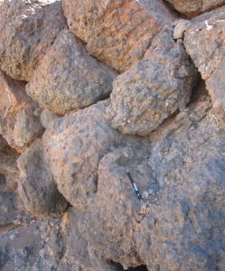 A thick bed of spherical and subspherical accretionary aggregates associated with explosive Miocene andesitic eruptions and rhyo-dacitic ignimbrites, Chilean Altiplano. There is a mix of ash pellets and ash-cored accretionary lapilli. Lapillus diameters range from 8 mm to 25 mm. Lapilli are packed in a clast-supported framework. 