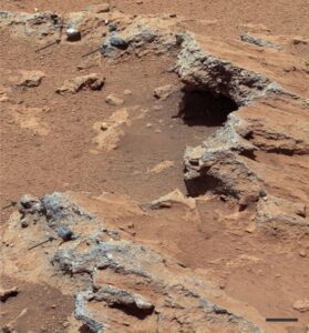 A thin conglomerate bed in Gale Crater containing pebbles up to 5 cm diameter. Most of the clasts here show moderate degrees of rounding, indicating relatively continuous abrasion during transport. Bar scale is 5 cm long. Image is a mosaic taken by Curiosity MastCam; September 15, 2012. PIA16156. Image Credit:
NASA/JPL-Caltech/MSSS