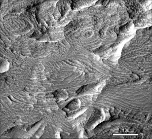 Multiple angular discordances in Gale Crater, interpreted by Ryan Anderson (USGS) to represent truncation surfaces between very large, overlapping crossbed sets, possibly resembling the aeolian crossbeds in the Jurassic Navajo Sandstone.