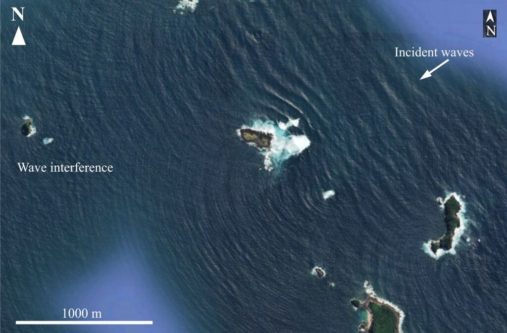 Diffraction of Pacific Ocean waves through narrow channels between small islands on the New Zealand east coast (Coromandel Peninsula). Wavelengths of the ocean waves are about 100 m; those of the diffracted waves 20-30 m. Interference patterns between sets of diffracted waves develop shoreward (left) of the channels. Image from Google Earth.